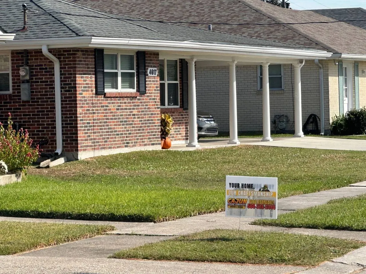 Metairie home with Cajun Home Services sign before second floor addition project