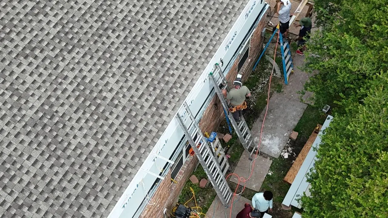 Architectural shingle roof with Hardie siding installation in progress on Metairie Louisiana home
