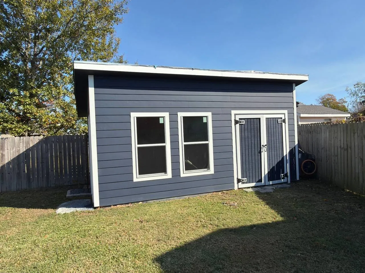 Fiber cement lap siding on a residential outbuilding in Metairie, Louisiana