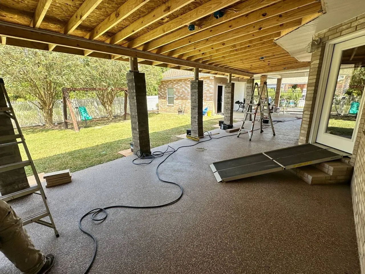 Covered patio soffit, column wraps, and fascia trim detail from below