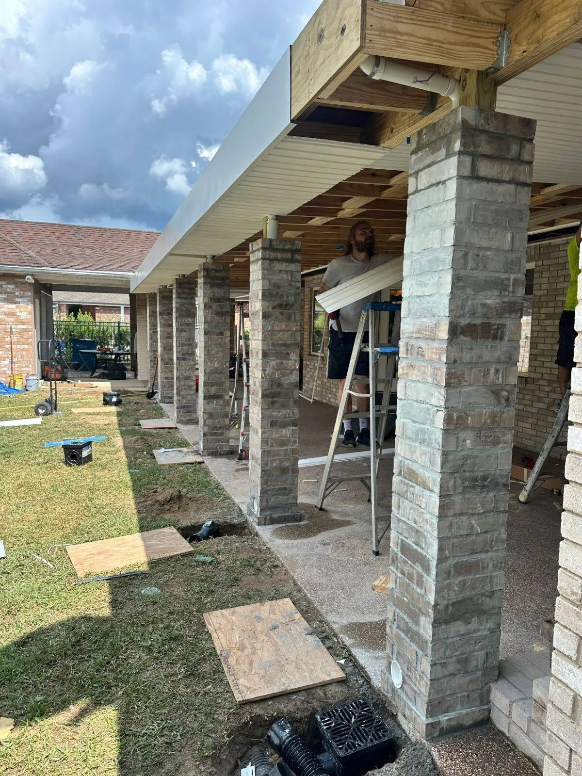Wrapped patio columns and lap siding on Destrehan home