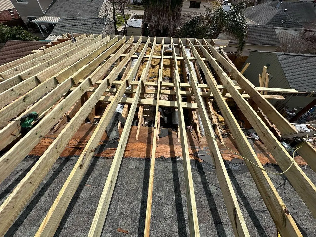 Aerial view of new roof rafters installed during complete roof rebuild in Kenner Louisiana