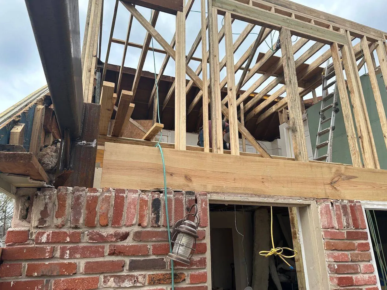 Second story wall framing with steel beam integration during home addition in Metairie