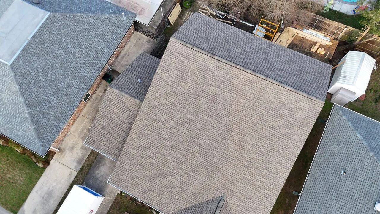 Aerial view of shingle roof on home with addition in Southeast Louisiana