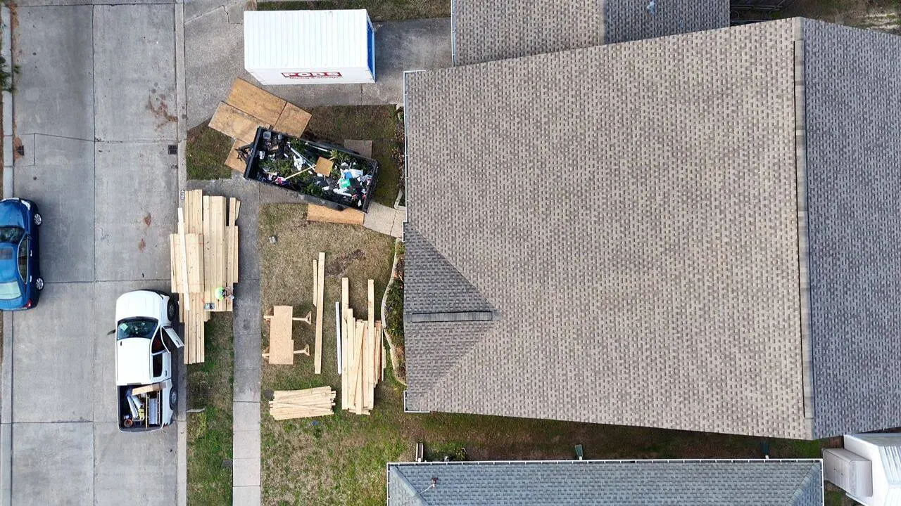 Aerial view of completed shingle roof replacement by Cajun Home Services