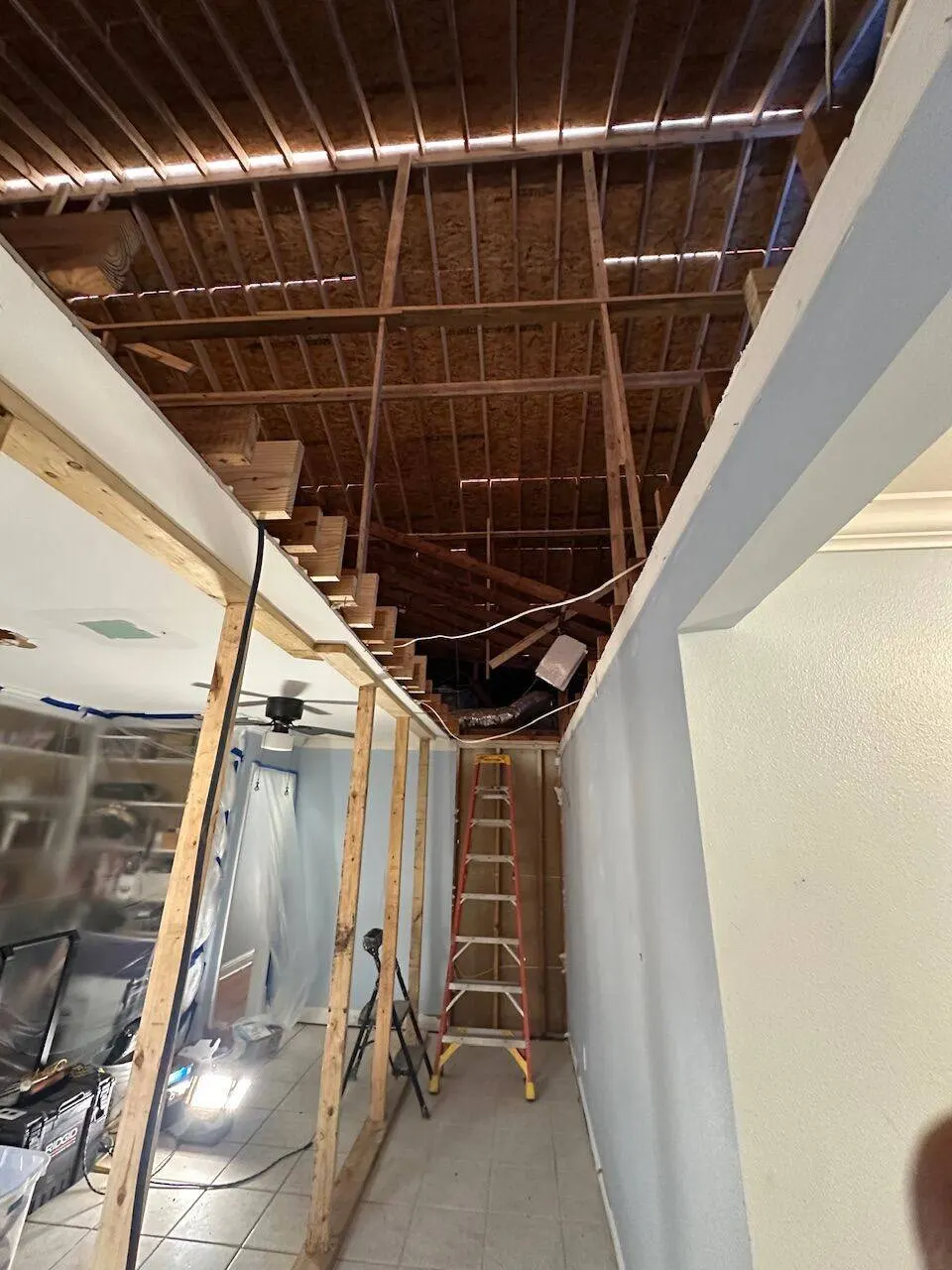 Stairwell opening with ceiling framing for second floor addition in Metairie