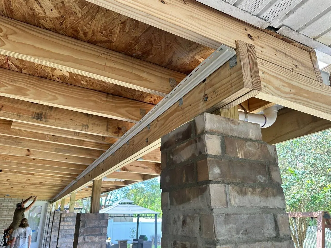 Structural beam and floor joist framing with hurricane straps on home addition in Kenner Louisiana
