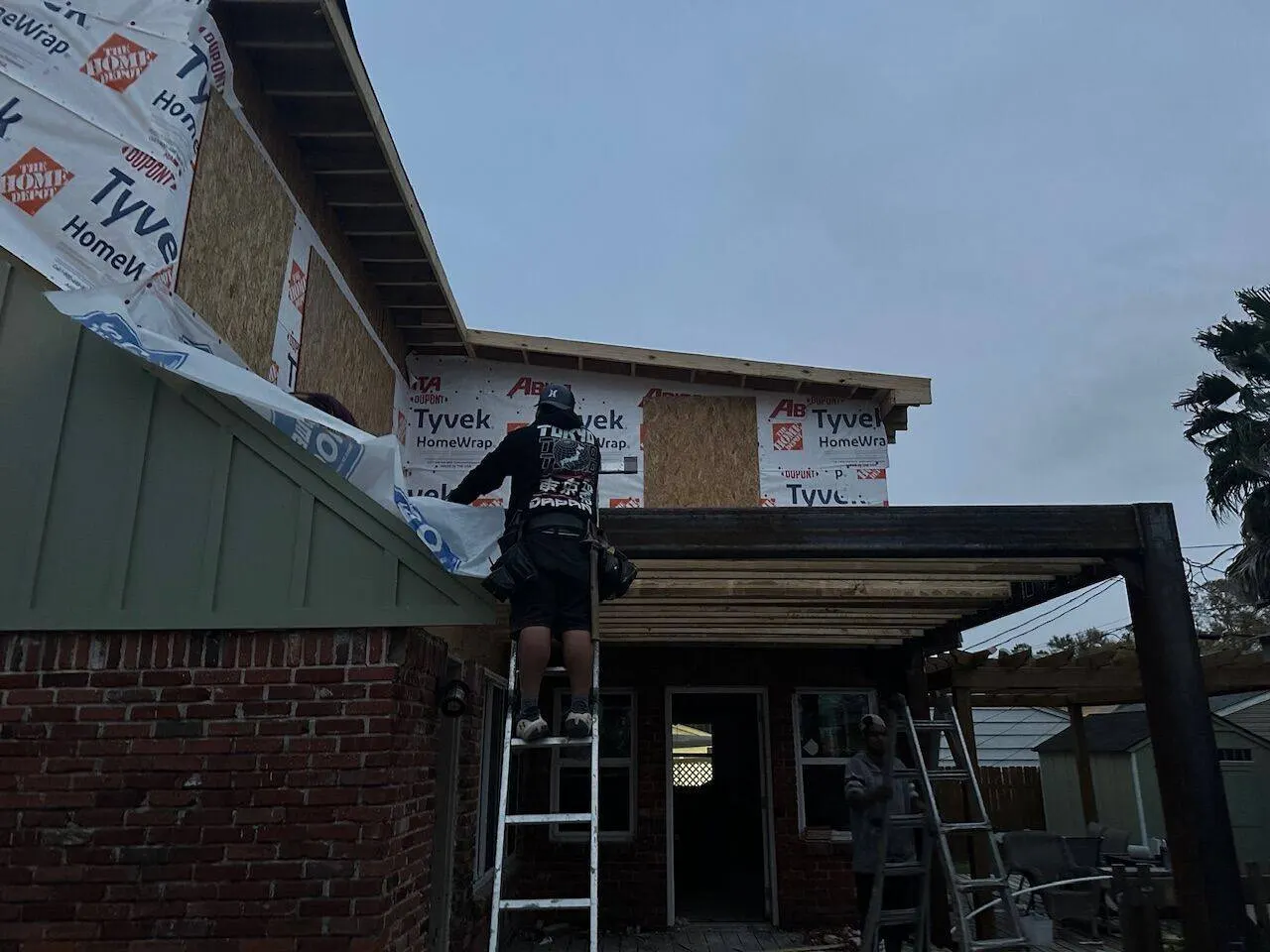 Second-story addition wrapped in Tyvek before siding application