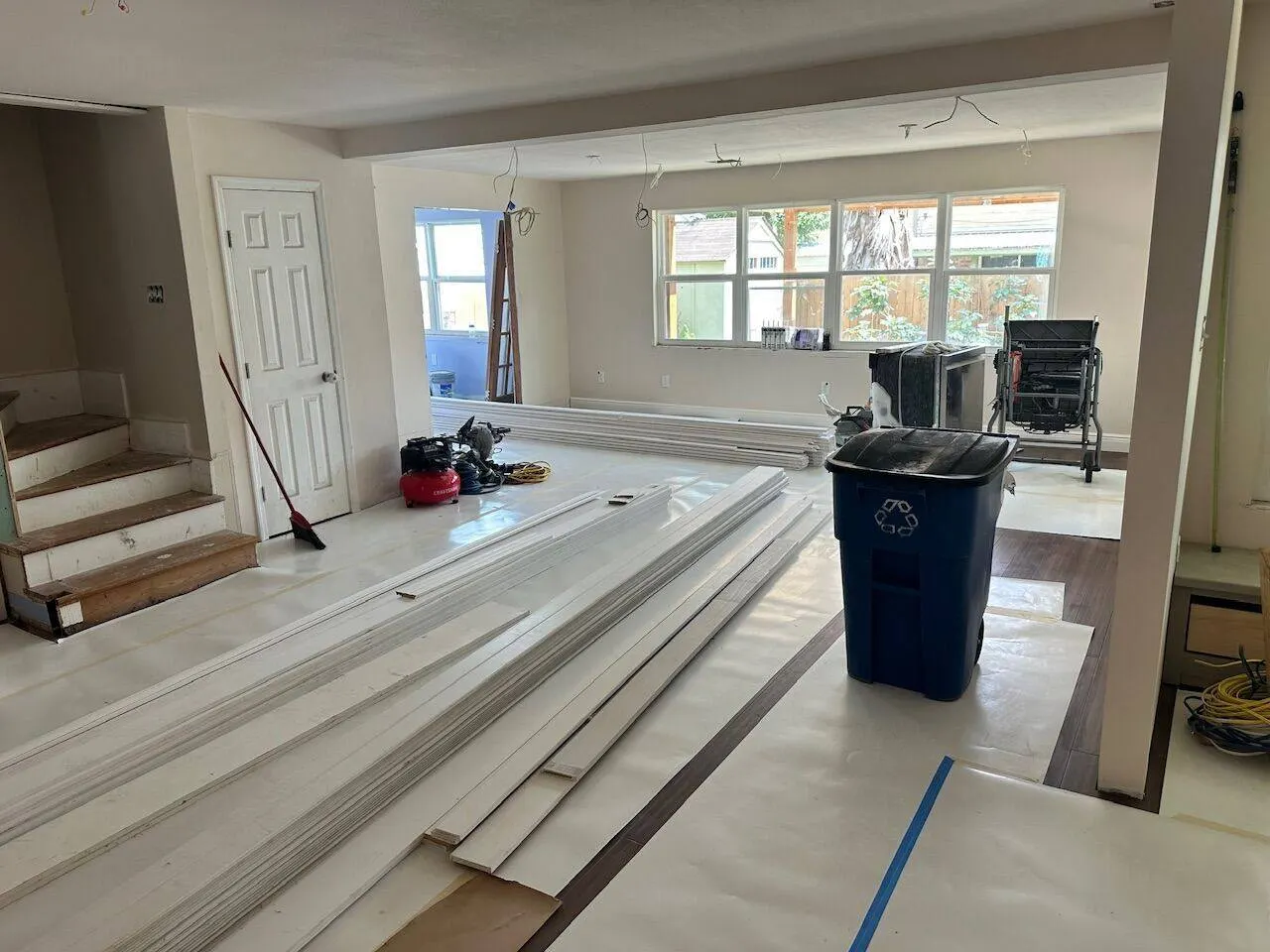 Trim and baseboard materials staged for installation during whole home renovation in Jefferson Parish