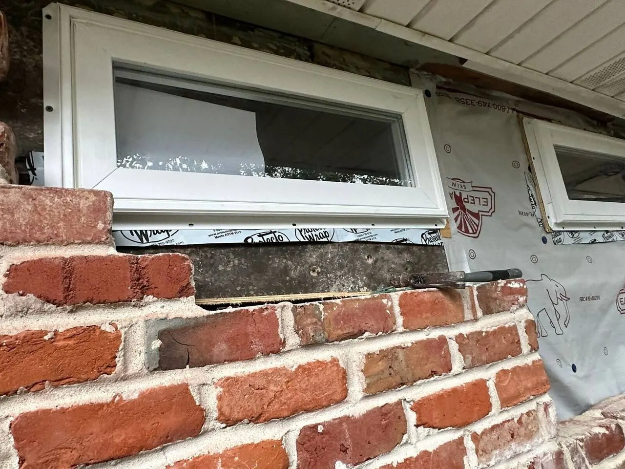 New window installation with house wrap and brick masonry restoration in New Orleans Louisiana